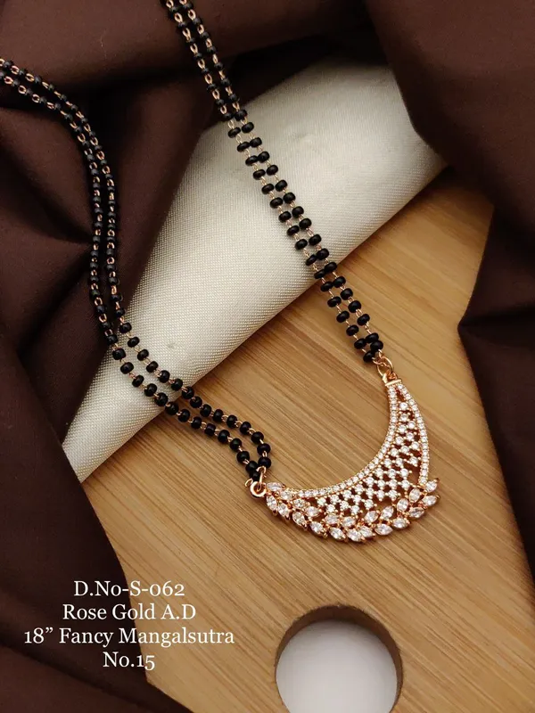 https://d1311wbk6unapo.cloudfront.net/NushopCatalogue/tr:f-webp,w-600,fo-auto/D-NO-S-062 ROSE GOLD AD 18 FANCY MANGALSUTRA_1684936624373_2leepe2zhpy9q7c.jpg__Ketmera